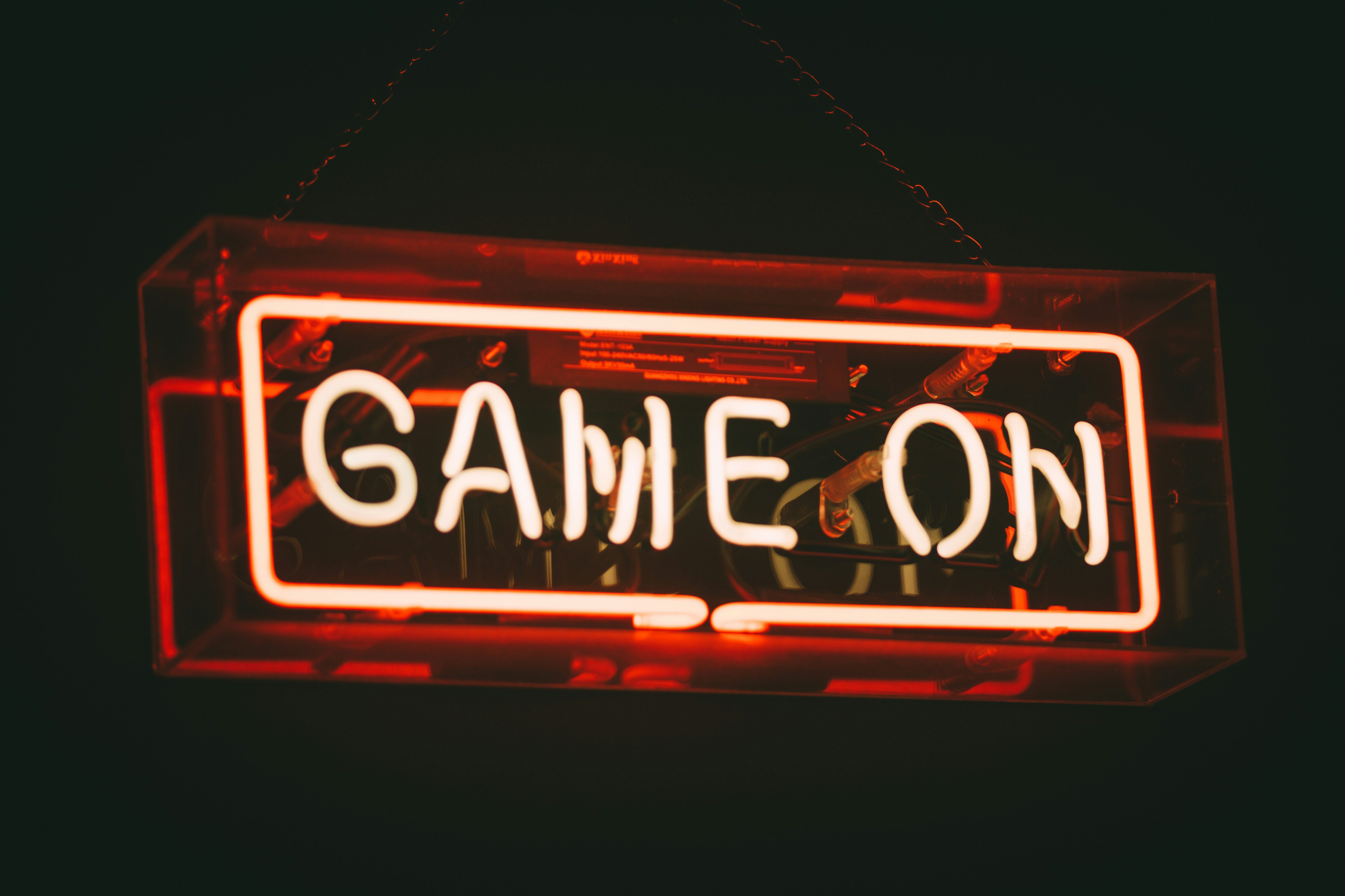 A glowing neon sign that reads GAME ON.